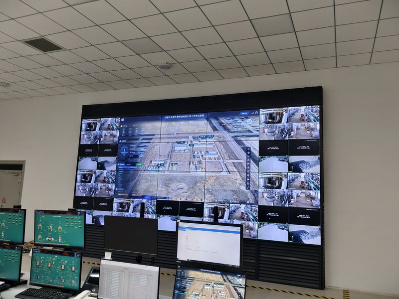Central control room with the plant-wide camera wall and DCS operator stations